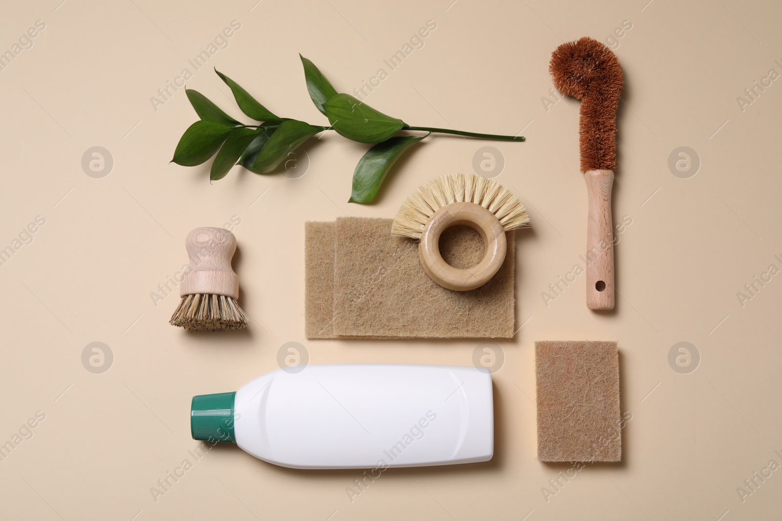 Photo of Flat lay composition with different cleaning supplies on beige background