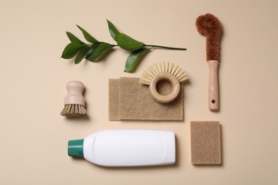 Flat lay composition with different cleaning supplies on beige background