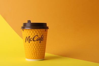 MYKOLAIV, UKRAINE - AUGUST 12, 2021: Hot McDonald's drink on color background. Space for text