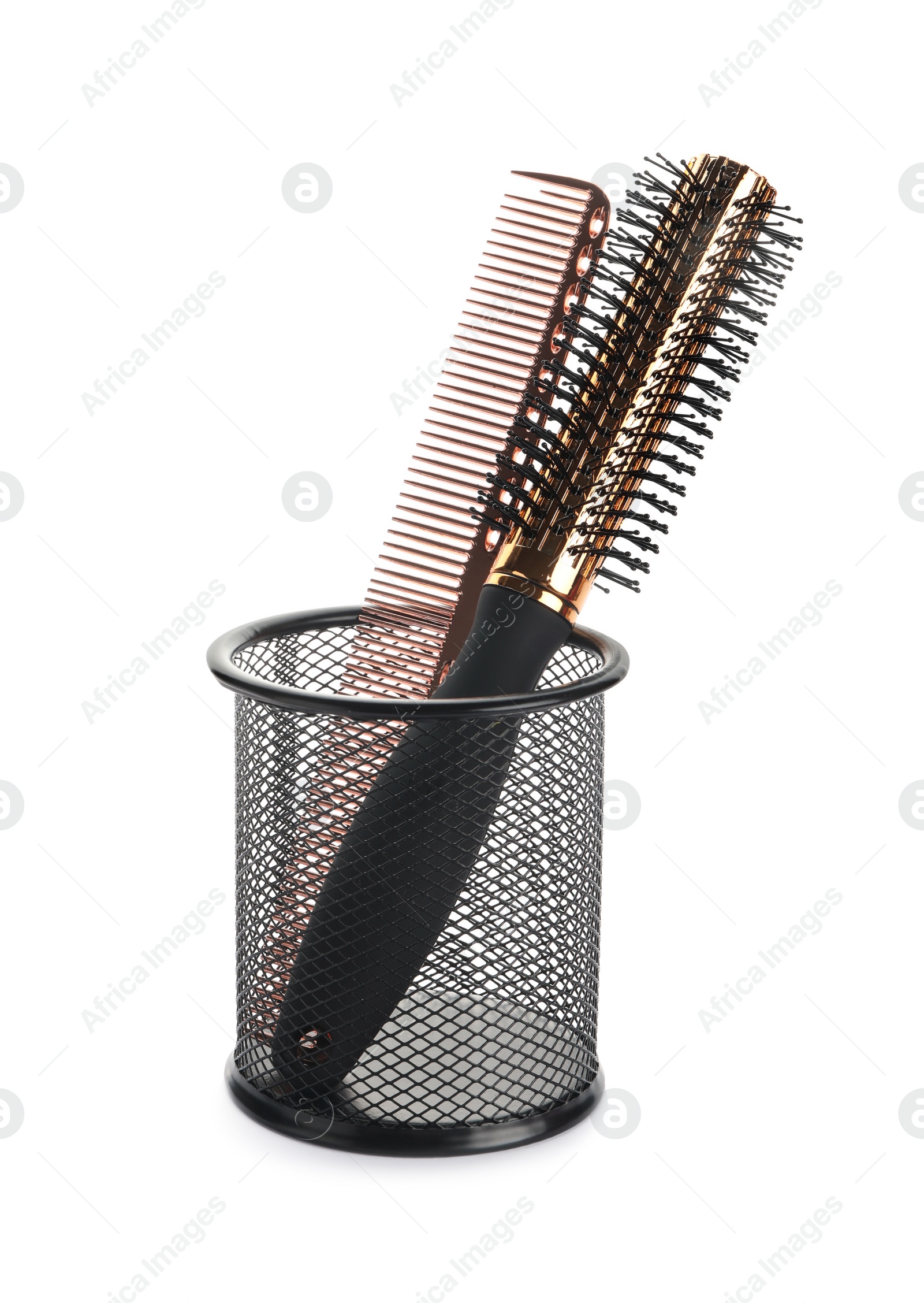 Photo of New modern hair brush and comb in metal holder isolated on white