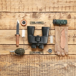 Set of military equipment on wooden background, flat lay