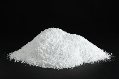 Photo of Heap of white snow on black background