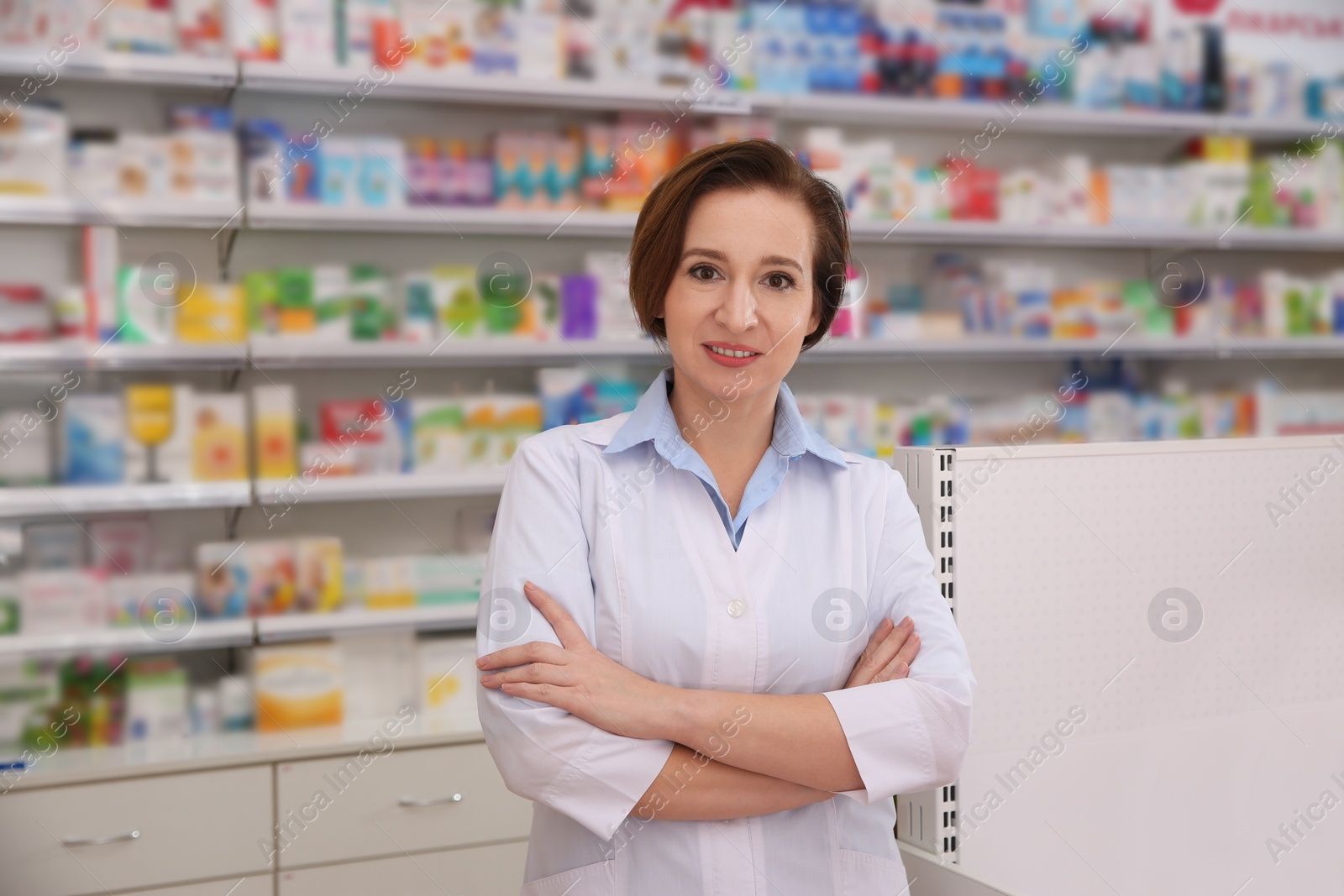 Image of Portrait of professional pharmacist in modern drugstore