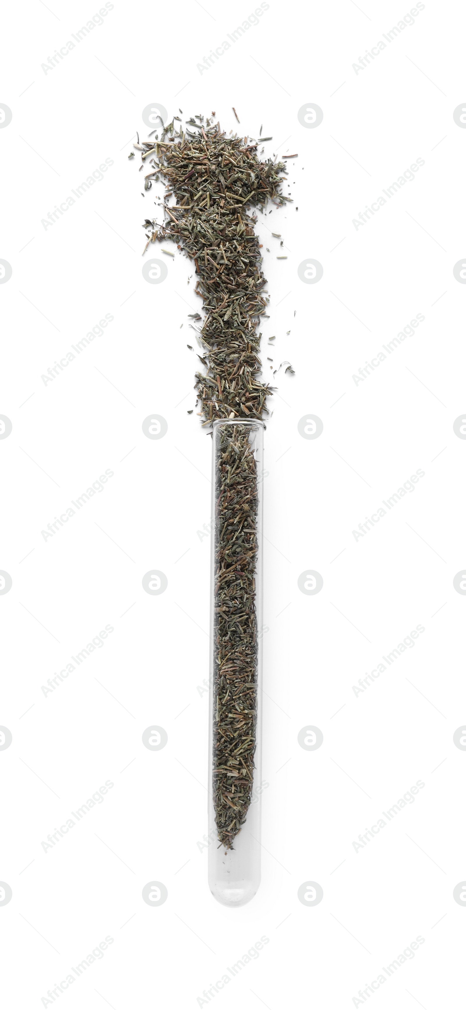 Photo of Glass tube with dry herb on white background, top view
