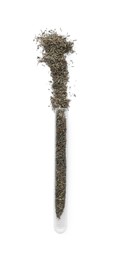 Photo of Glass tube with dry herb on white background, top view