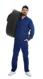 Photo of Full length portrait of professional auto mechanic with tire on white background