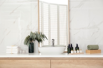 Modern bathroom interior with stylish mirror and vessel sink