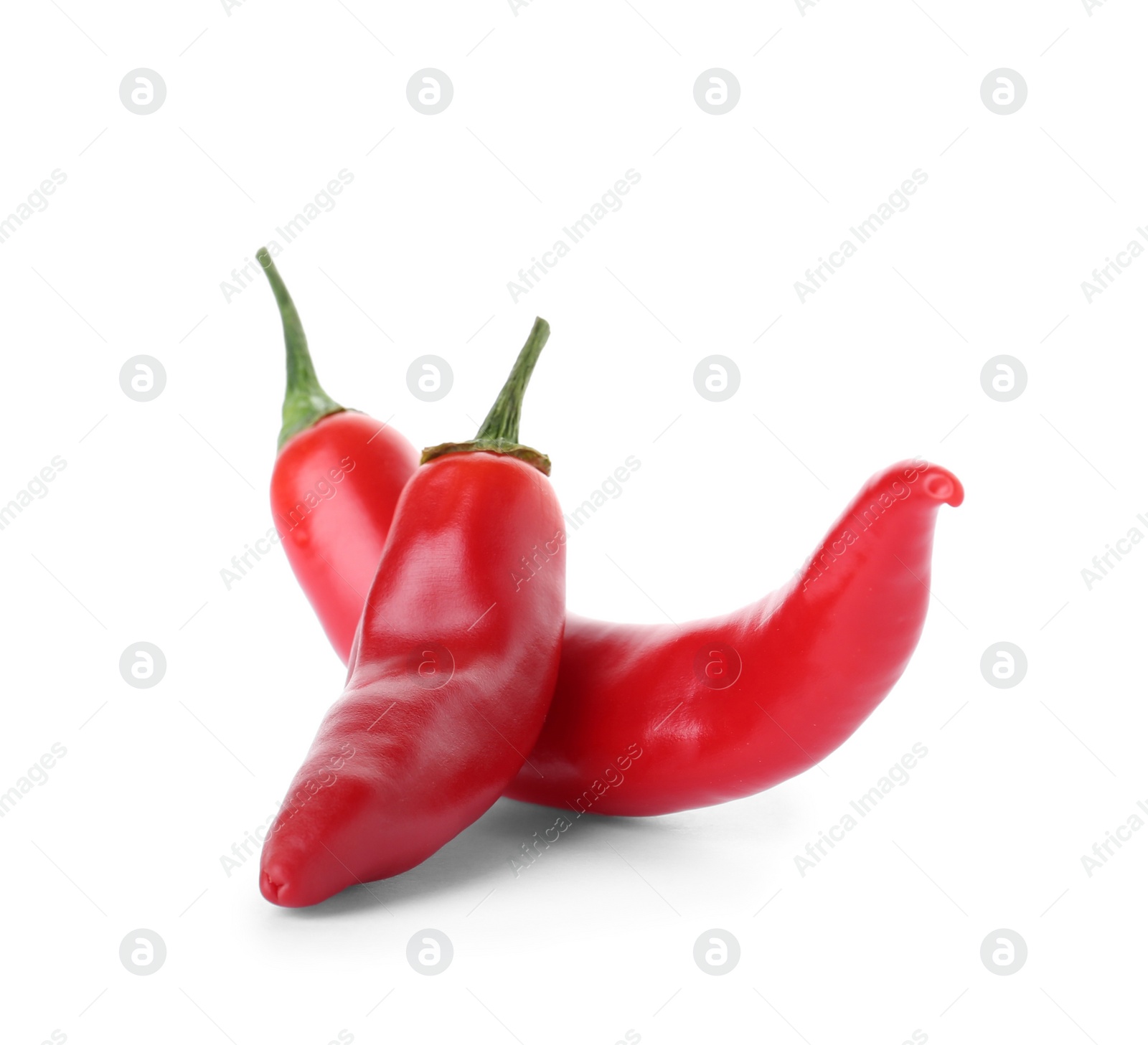 Photo of Ripe hot chili peppers on white background