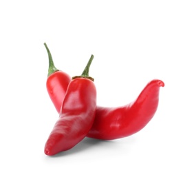 Photo of Ripe hot chili peppers on white background