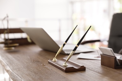 Office pen holder on desk in notary's office