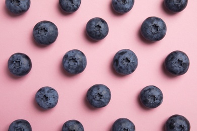 Photo of Flat lay composition with tasty blueberry on color background