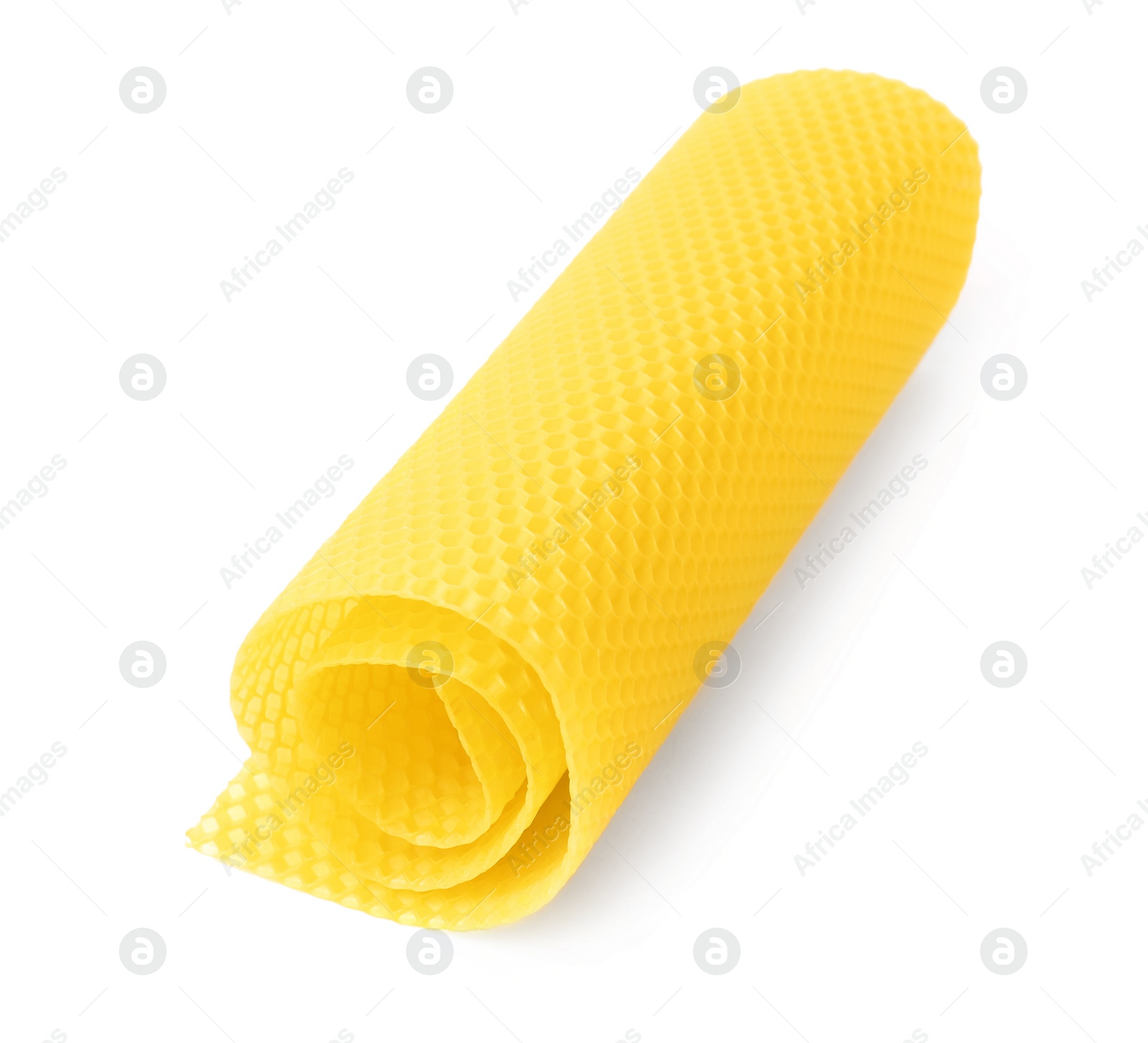 Photo of Rolled organic beeswax sheet isolated on white