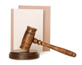 Photo of Wooden gavel and books on white background