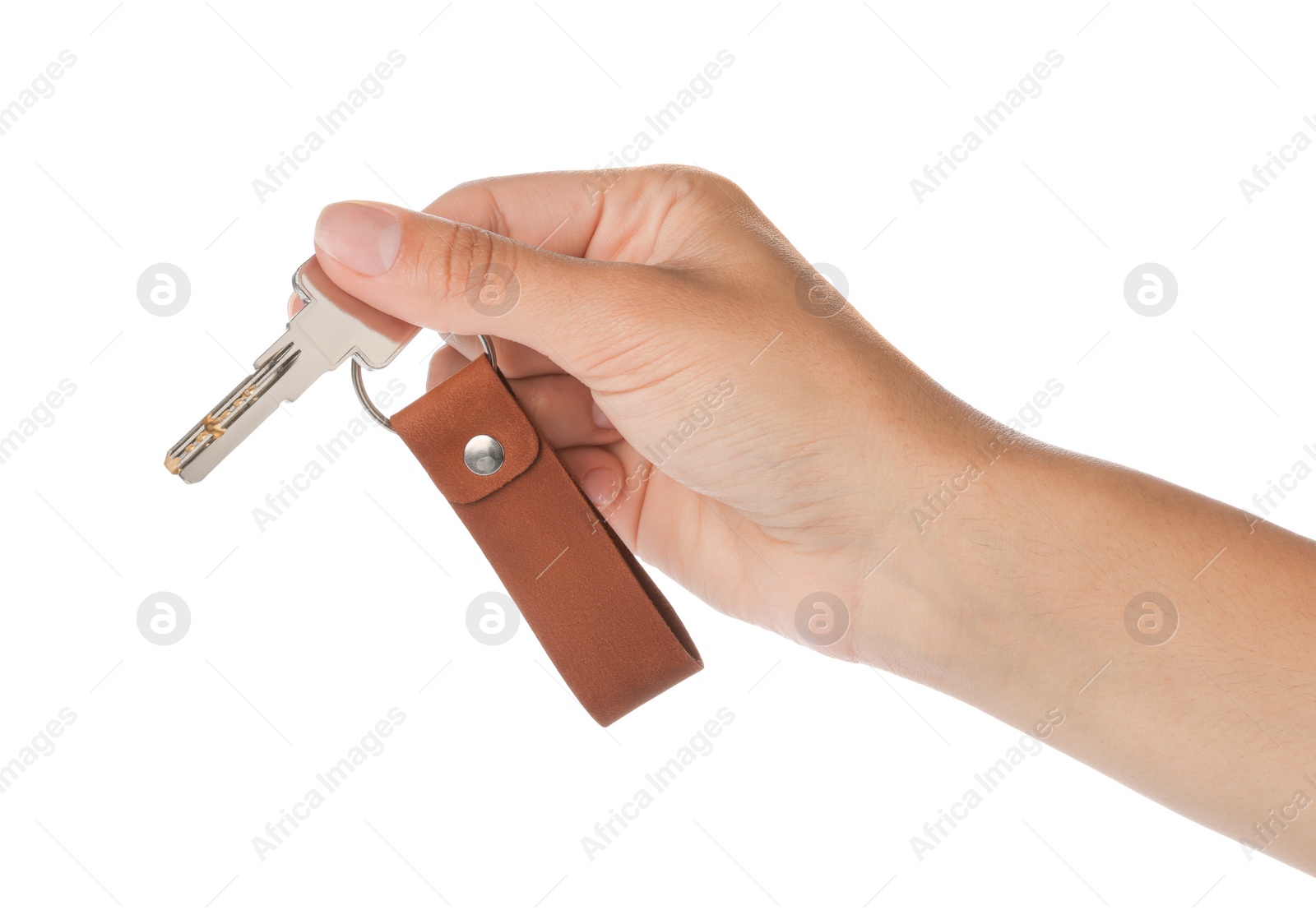 Photo of Woman holding key with leather keychain on white background, closeup