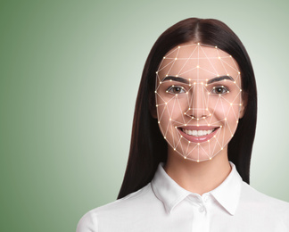 Facial recognition system. Young woman with biometric identification scanning grid on light green background, space for text