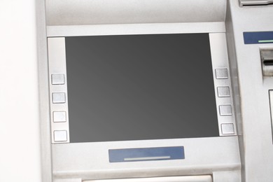 Modern automated cash machine with screen outdoors, closeup