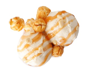 Photo of Scoops of delicious ice cream with caramel sauce and popcorn on white background, top view