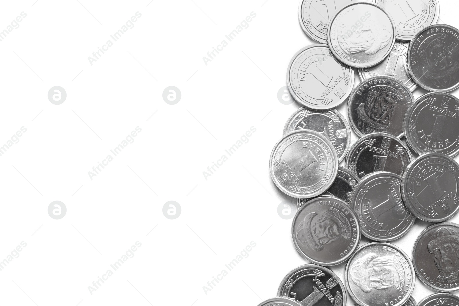 Photo of Many Ukrainian coins on white background, top view. National currency