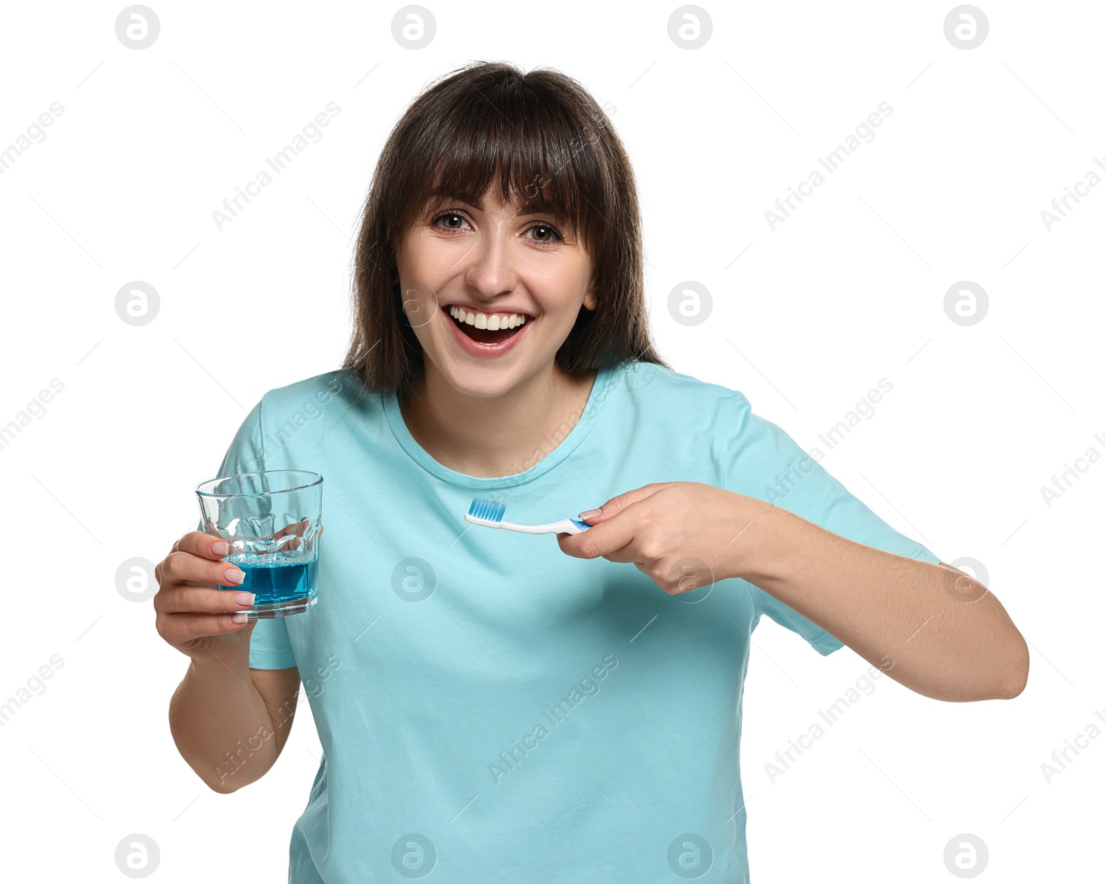 Photo of Young woman with mouthwash and toothbrush on white background