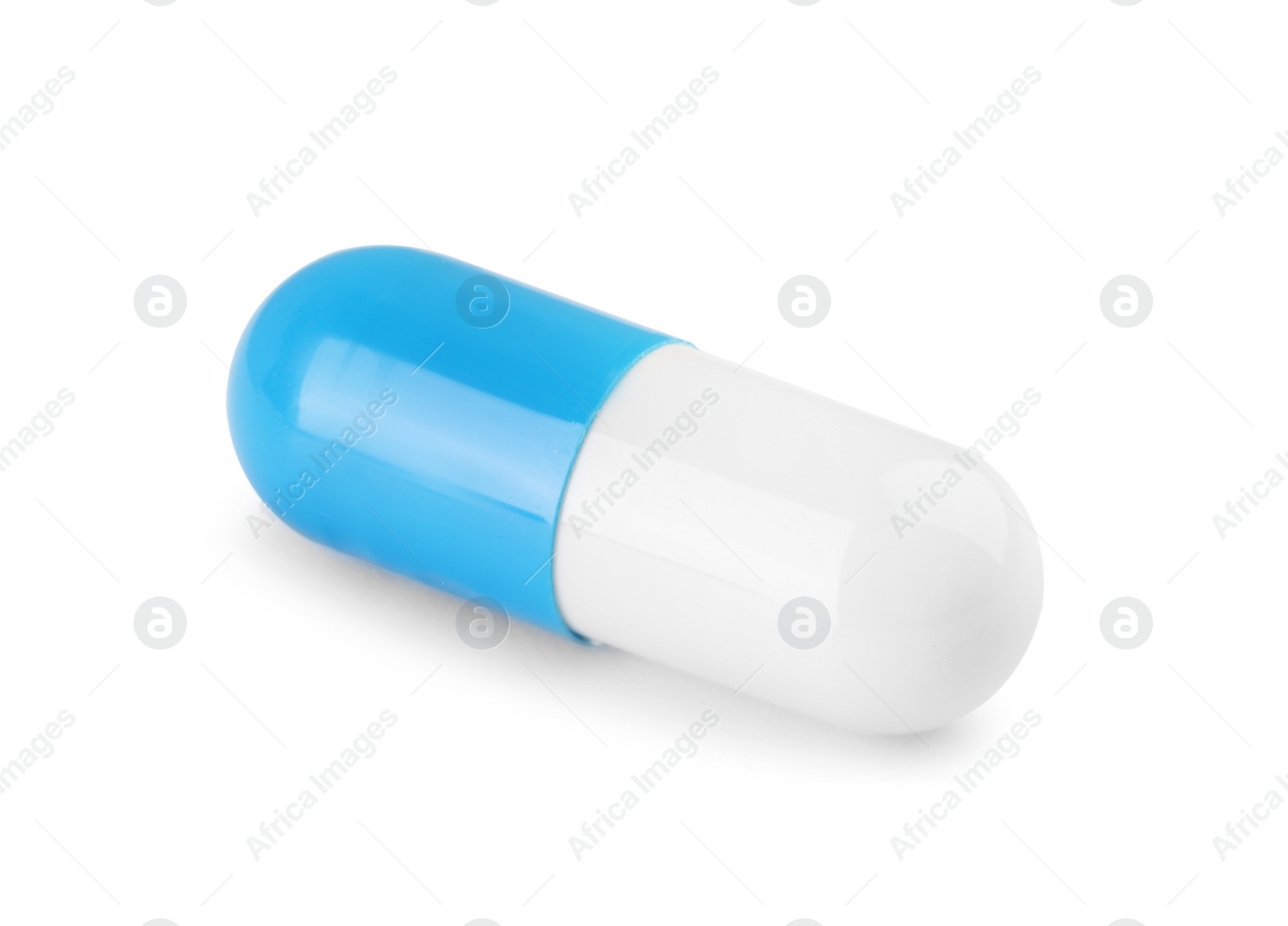 Photo of One antibiotic pill isolated on white. Medicinal treatment