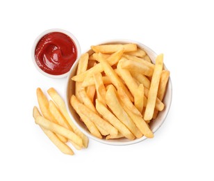 Photo of Bowl with tasty French fries and ketchup on white background, top view