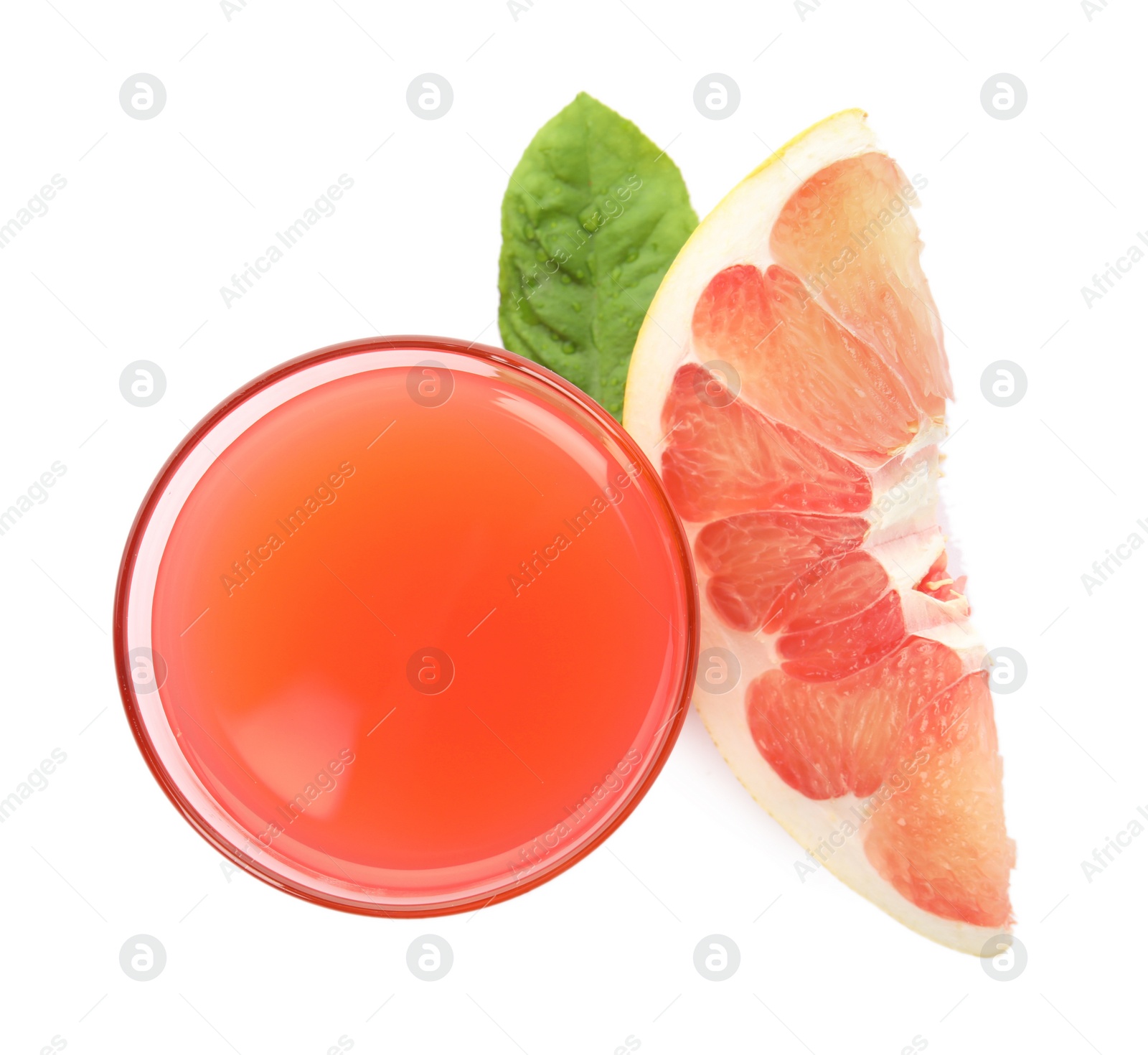 Photo of Glass of pink pomelo juice, fruit and green leaf isolated on white, top view