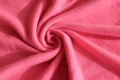 Photo of Beautiful pink fabric as background, top view