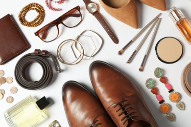 Photo of Fashionable male and female accessories on white background, flat lay