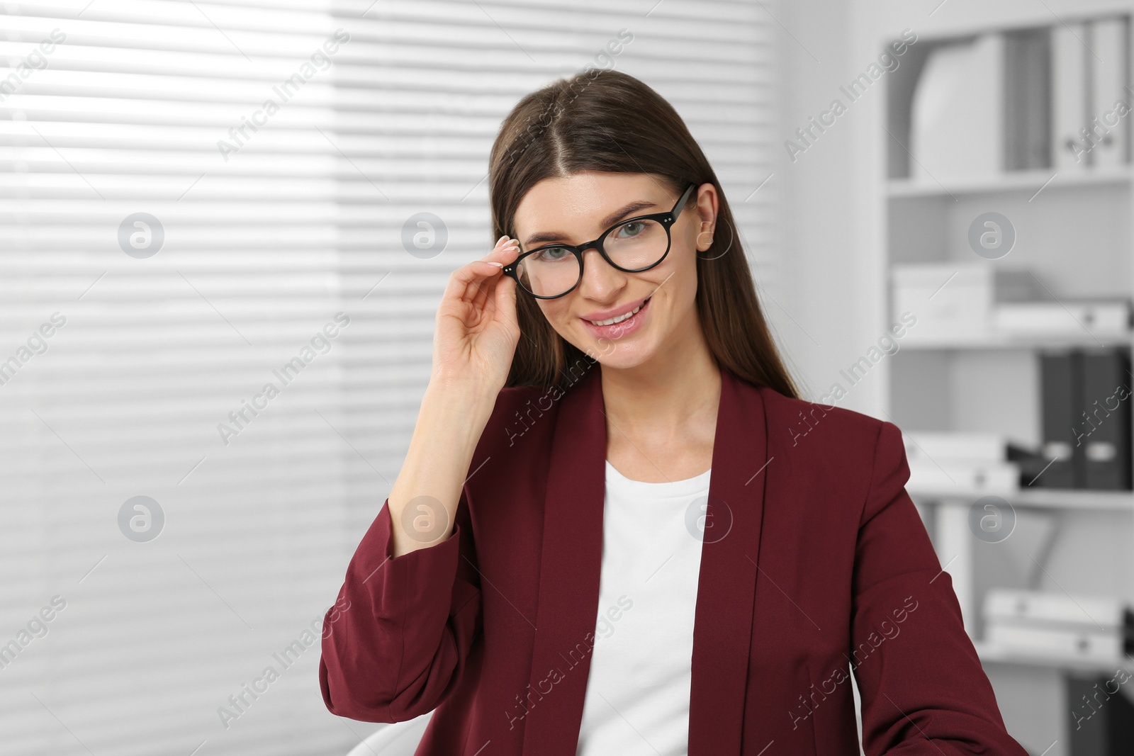 Photo of Happy woman in glasses having online video call at home, view from web camera