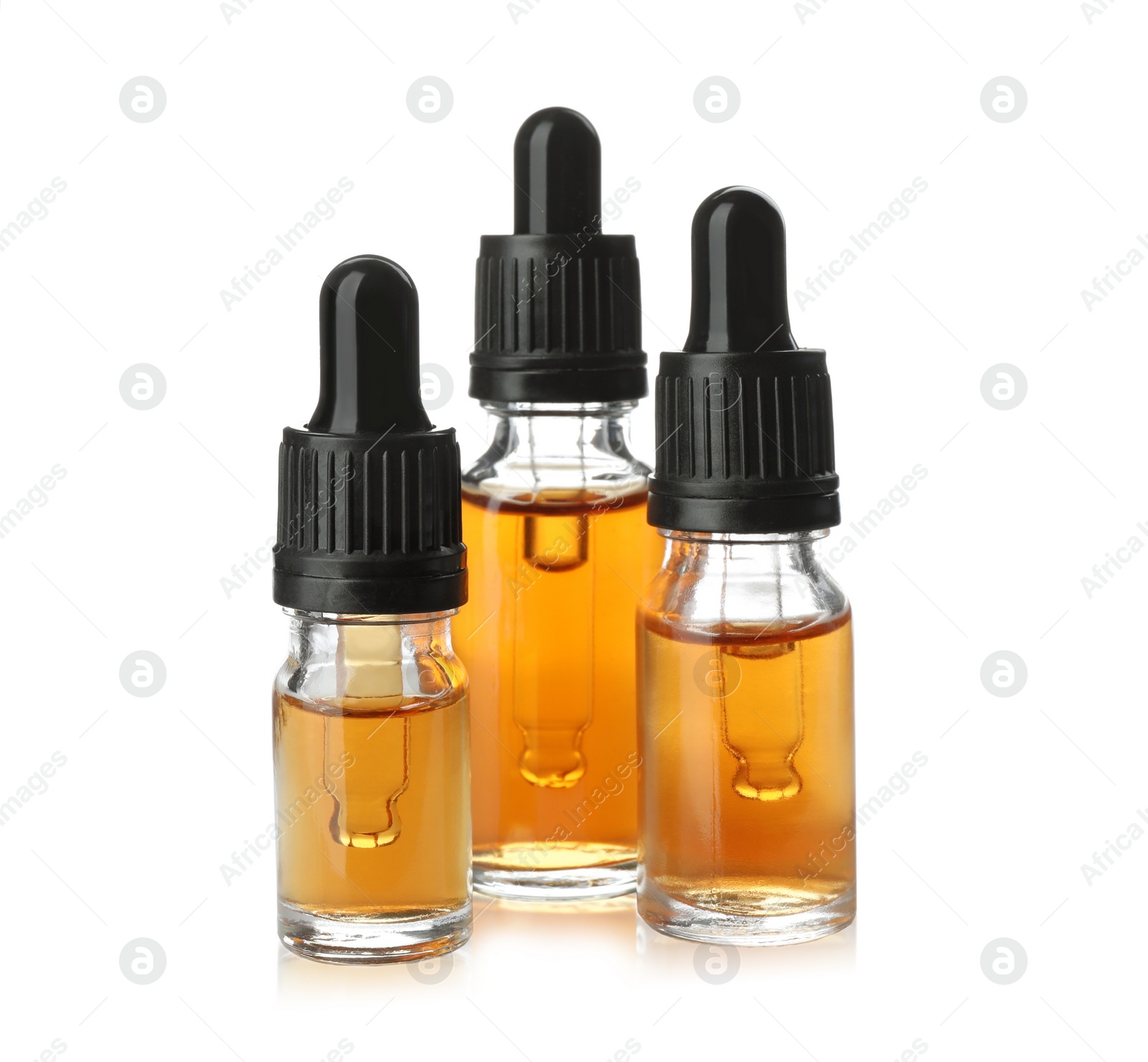 Photo of Bottles of essential oil isolated on white