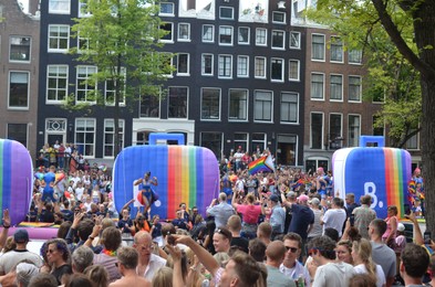 AMSTERDAM, NETHERLANDS - AUGUST 06, 2022: Many people at LGBT pride parade on summer day
