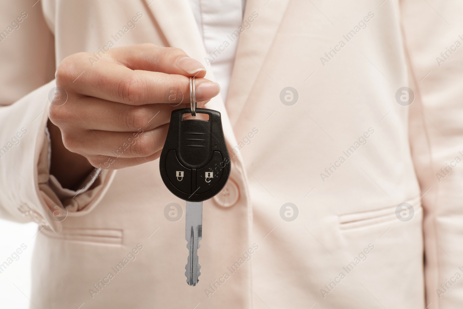 Photo of Young woman holding car key, closeup view