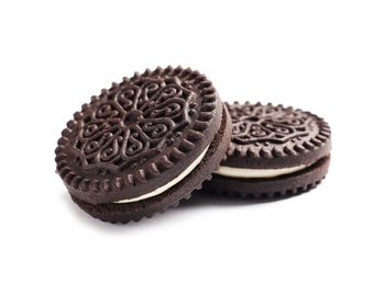 Tasty chocolate cookies with cream on white background