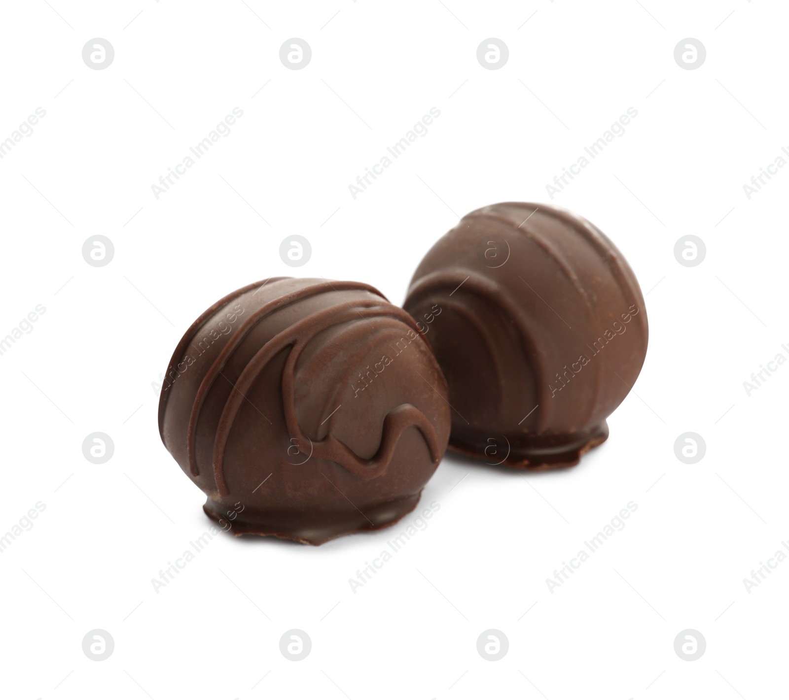 Photo of Delicious sweet chocolate truffles on white background