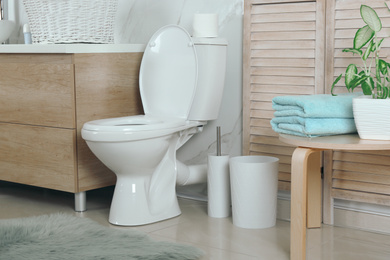 Photo of Stylish toilet bowl in modern bathroom interior