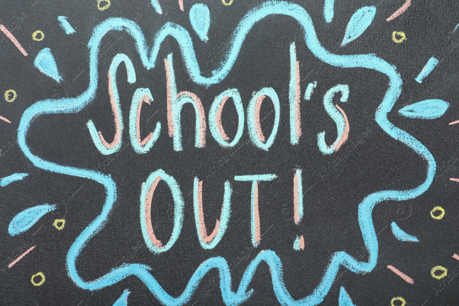 Photo of Text School's Out written on black chalkboard. Summer holidays