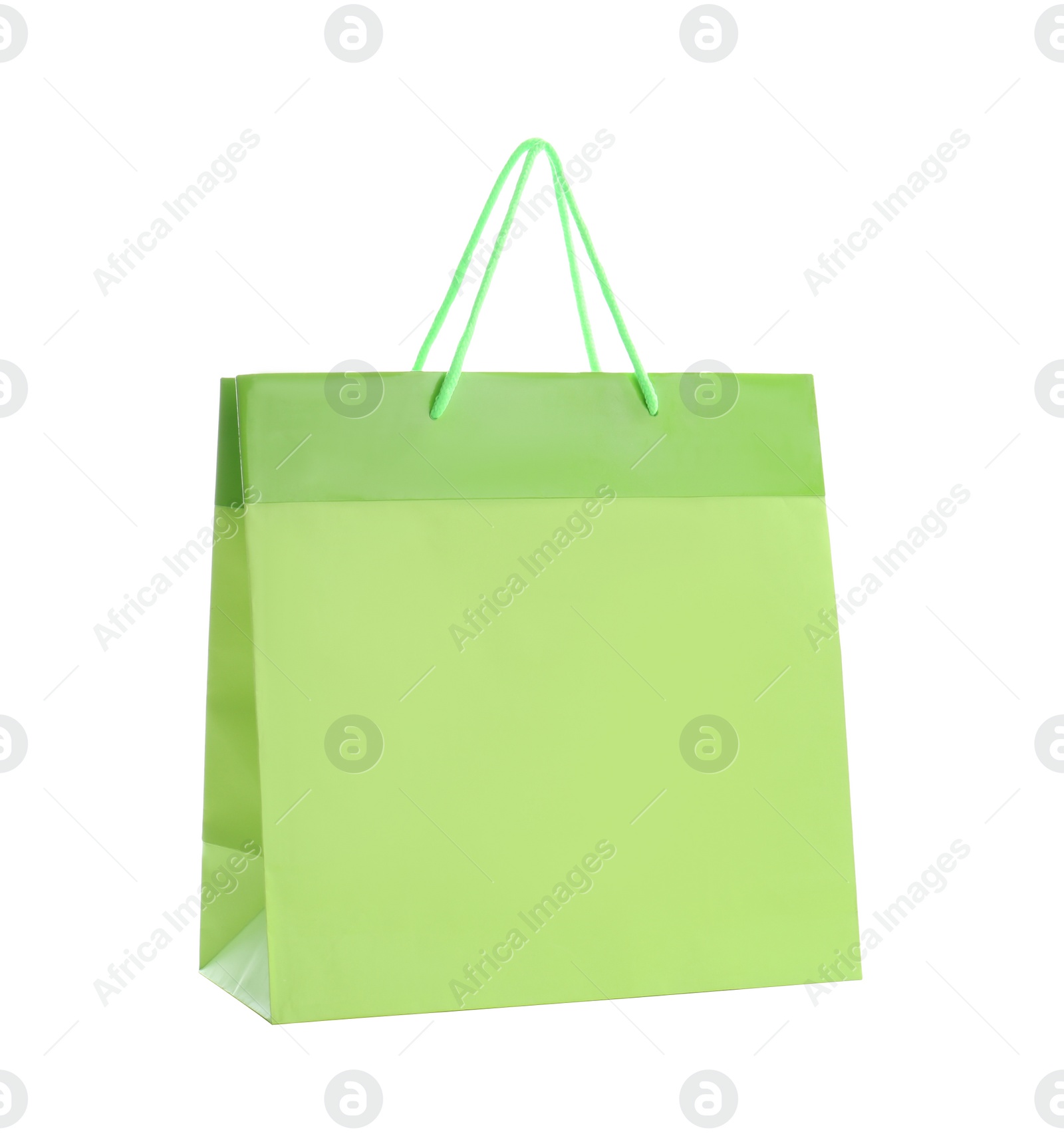 Photo of Green paper shopping bag isolated on white