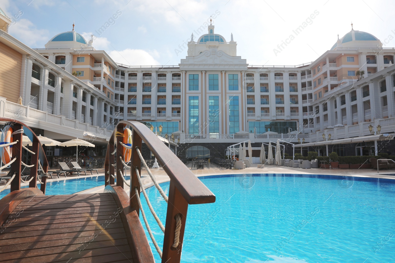 Photo of Beautiful view of hotel with swimming pool at resort