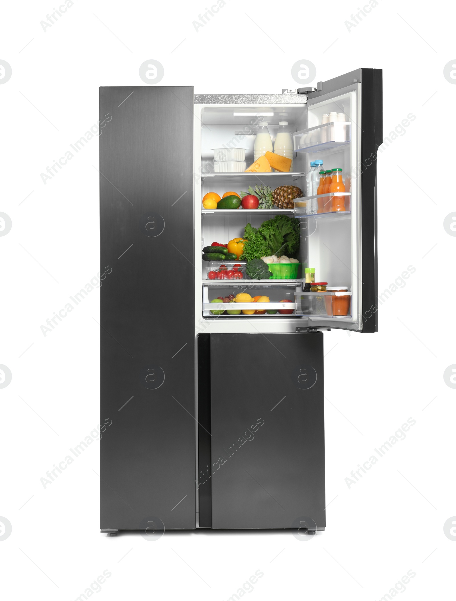 Photo of Open refrigerator full of different products isolated on white