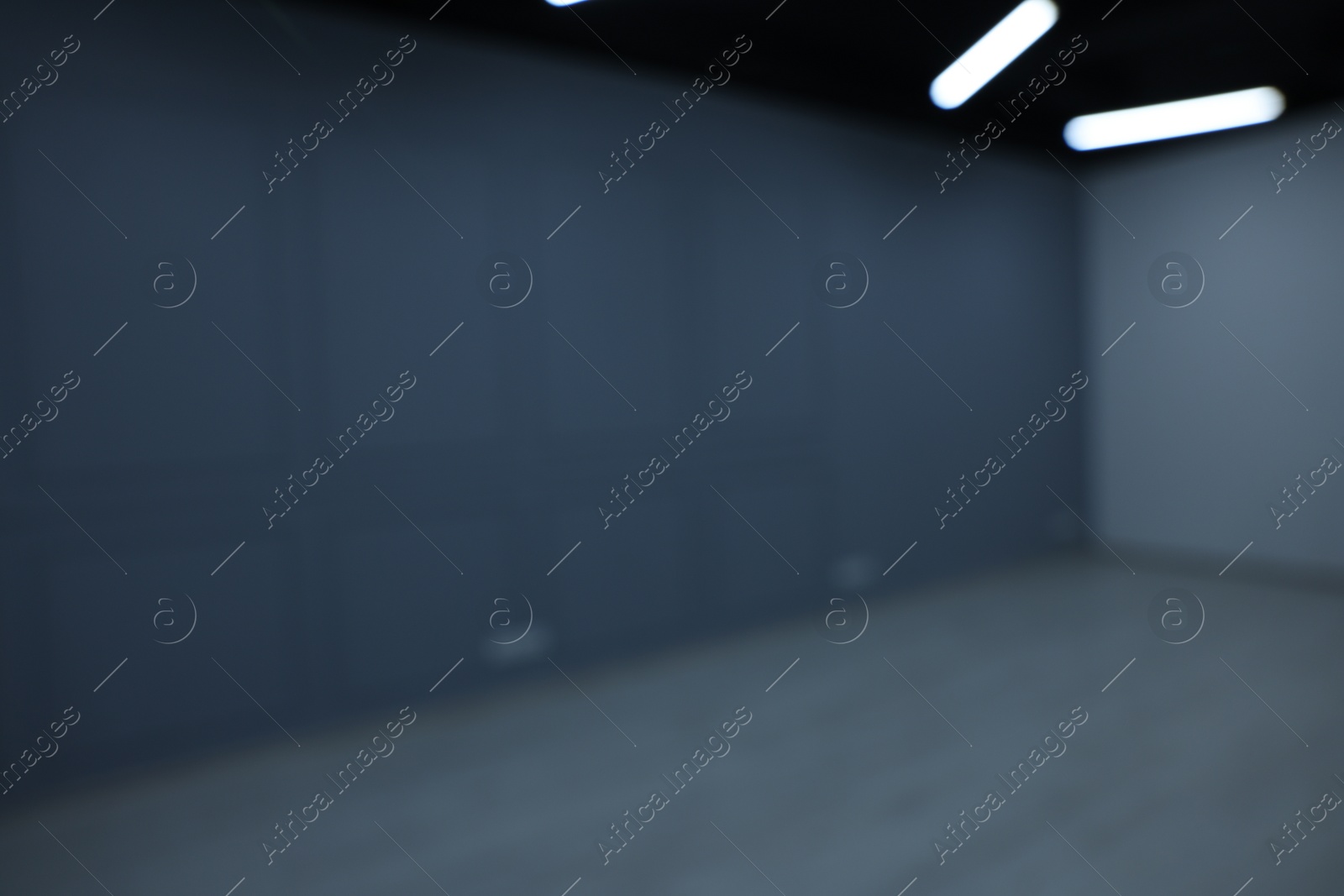 Photo of Blurred view of empty renovated room with light walls