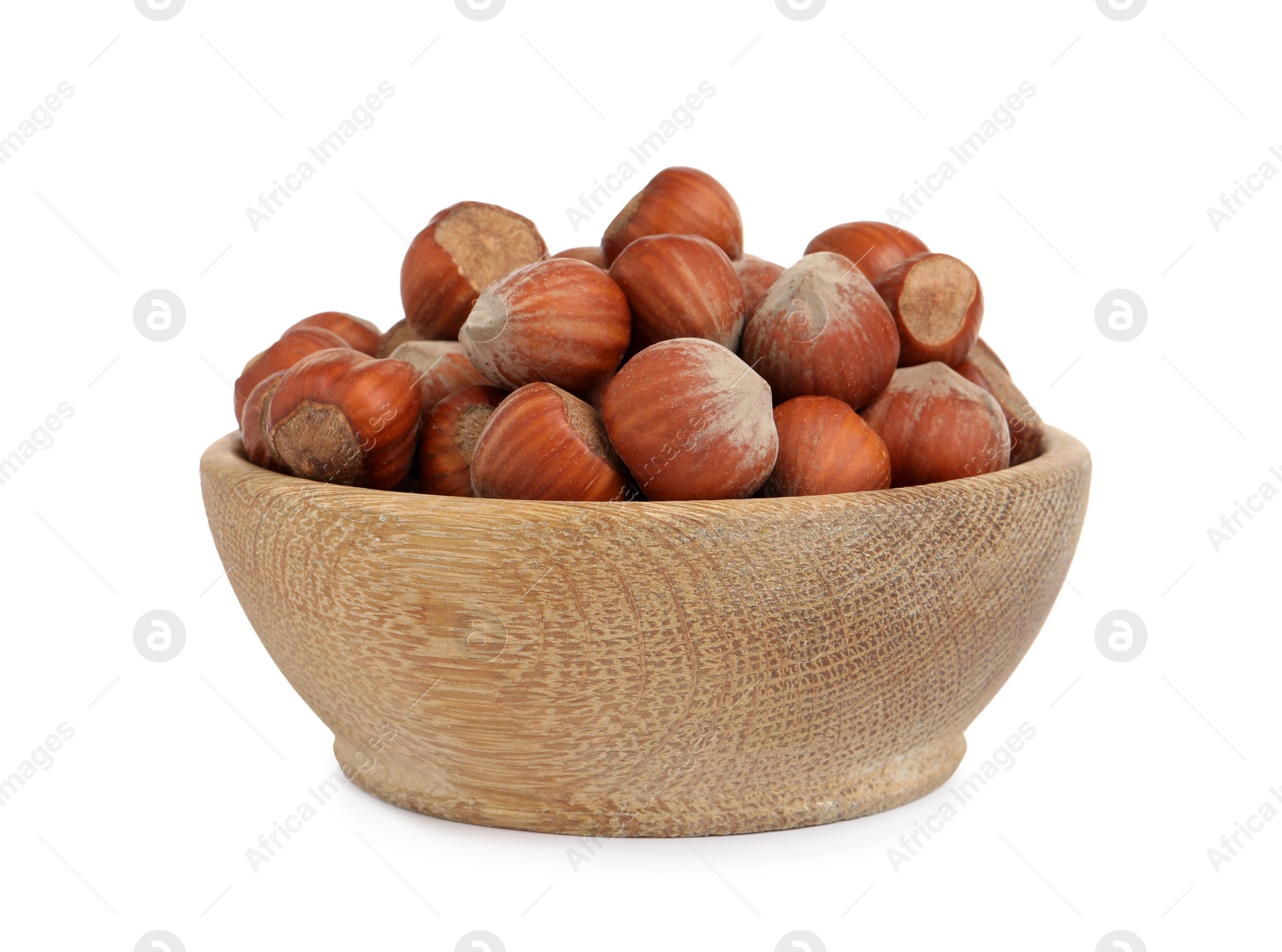 Photo of Bowl with tasty organic hazelnuts on white background