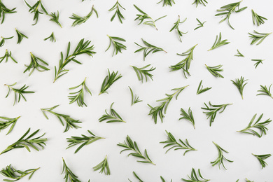 Flat lay composition with fresh rosemary on light background