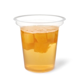 Tasty jelly dessert with slices of fruit in plastic cup on white background