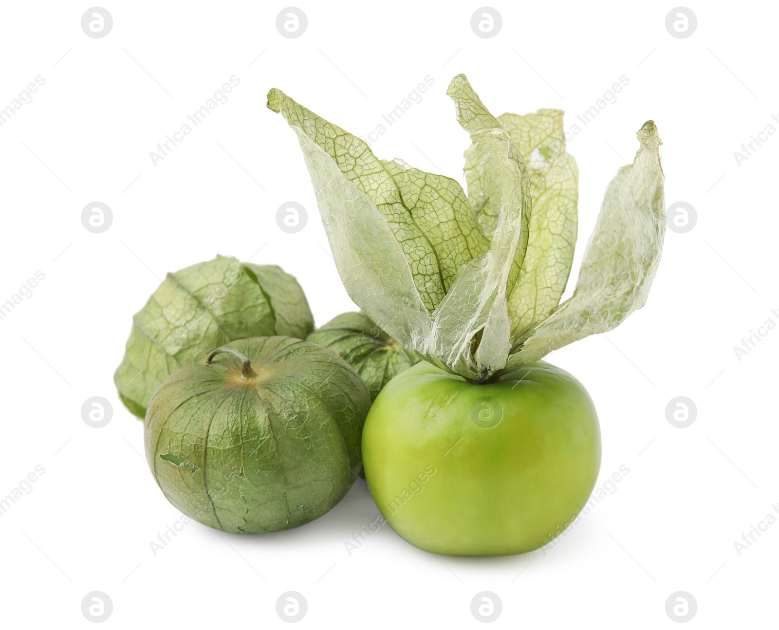 Photo of Fresh green tomatillos with husk isolated on white