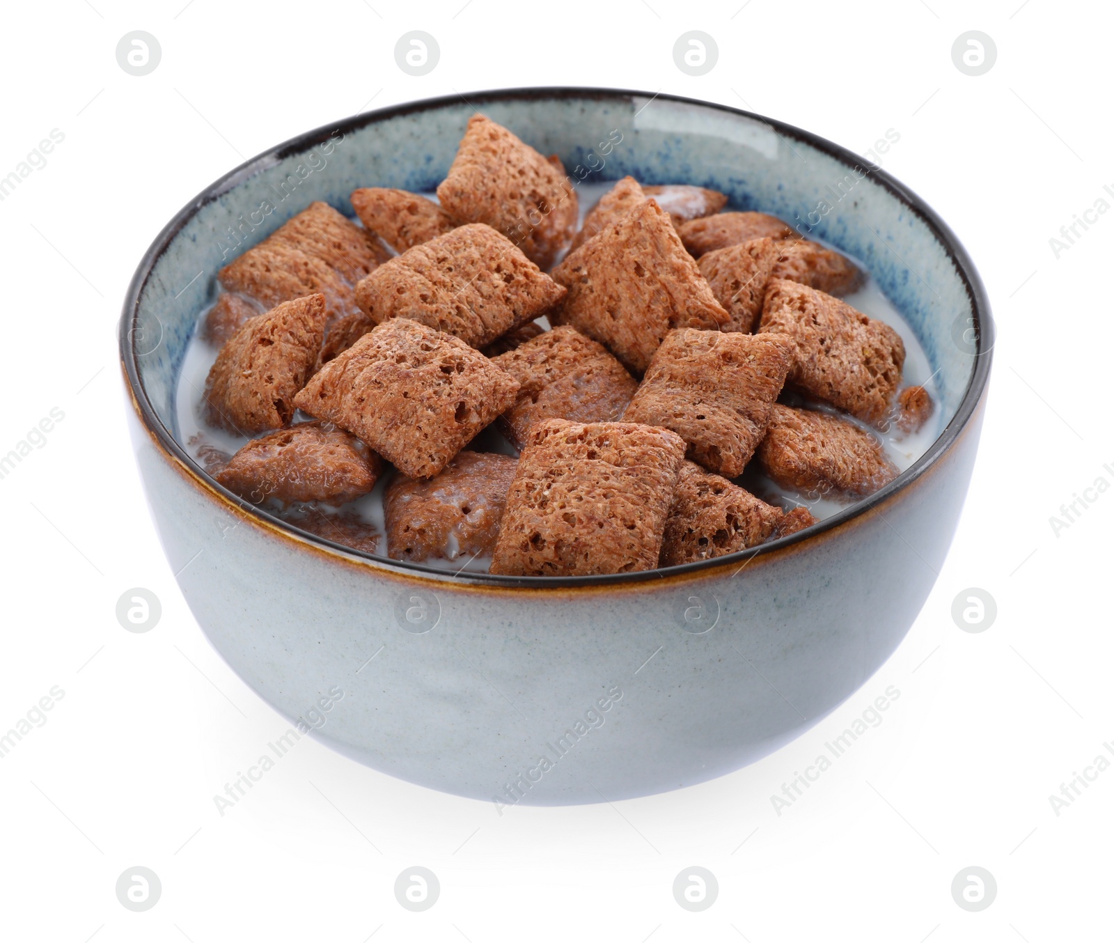 Photo of Tasty corn pads with milk in bowl isolated on white