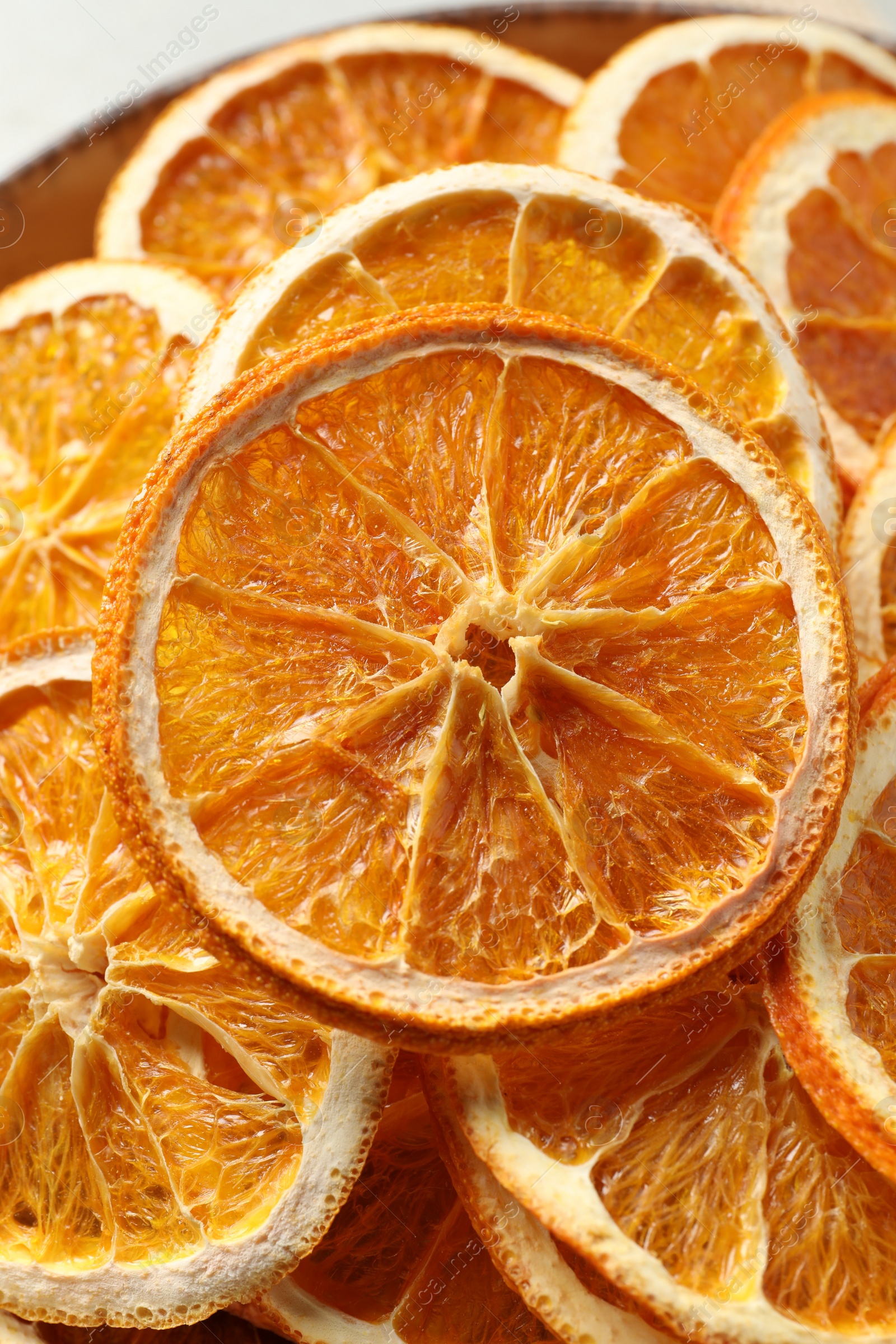 Photo of Bowl of dry orange slices, closeup view