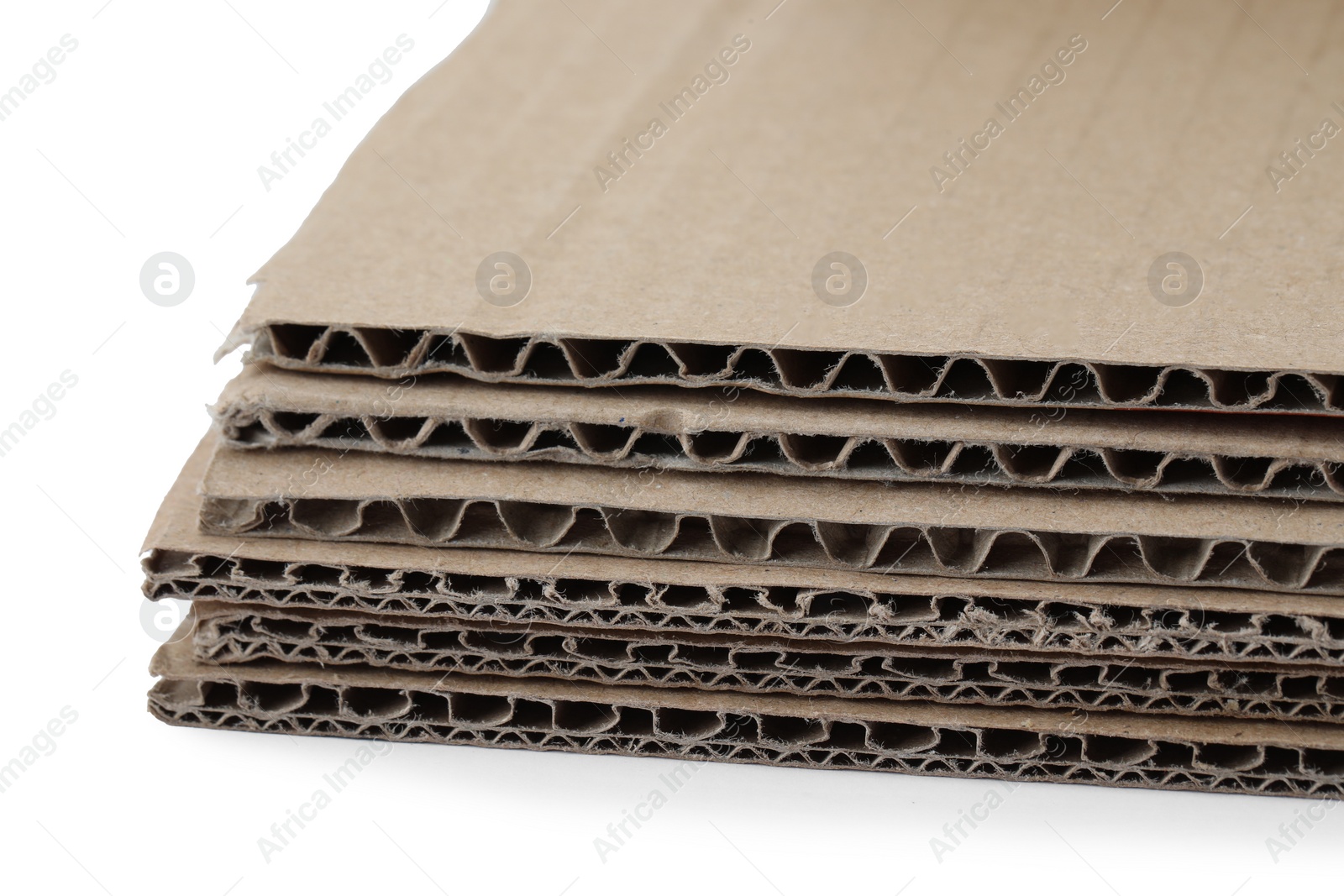 Photo of Sheets of brown corrugated cardboard isolated on white