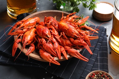 Composition with delicious red boiled crayfishes on table
