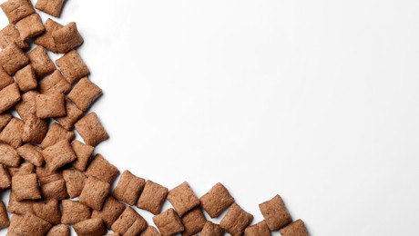 Delicious chocolate corn pads on white background, top view