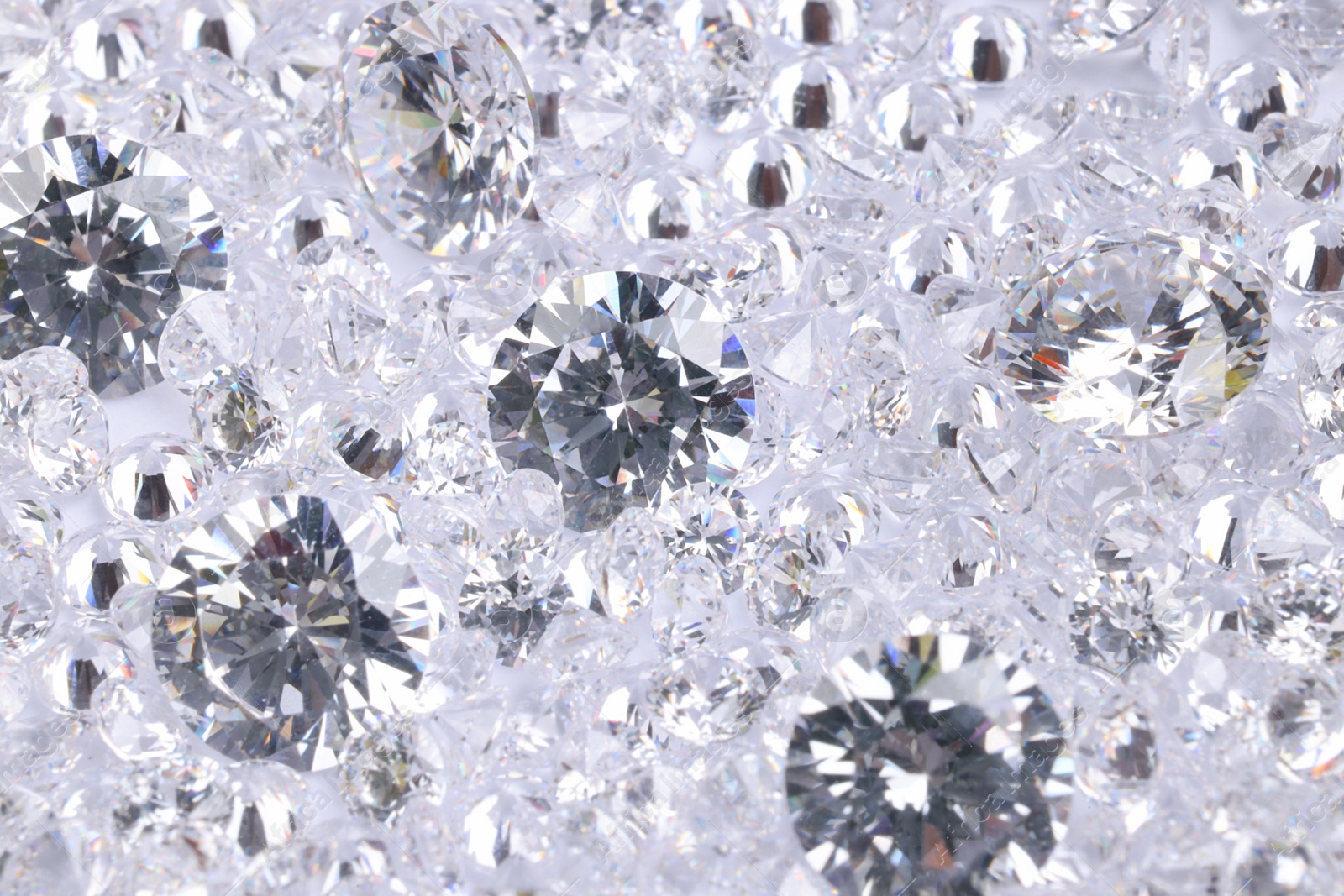 Photo of Many beautiful shiny diamonds as background, closeup